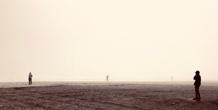 Lost souls on a foggy beach
