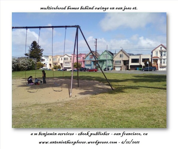 multicolored homes behind swings
