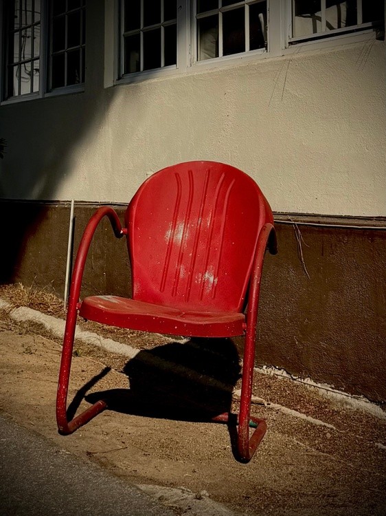 A Red Chair In The Sun