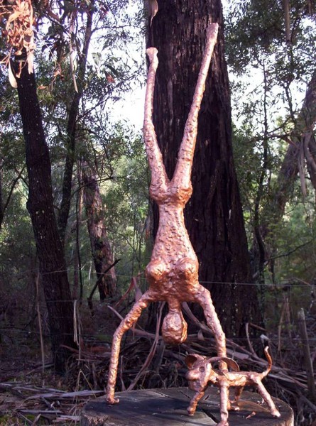 Woman doing handstand with dog