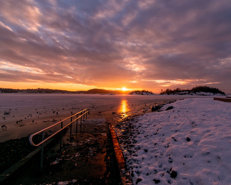 Sunset over frozen sea