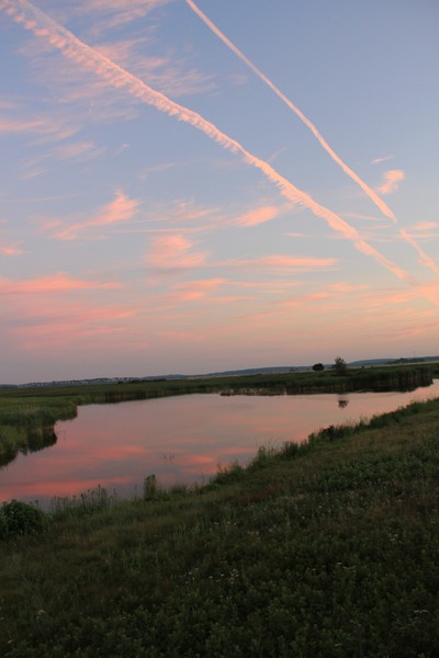 After-burner clouds sunset-lit