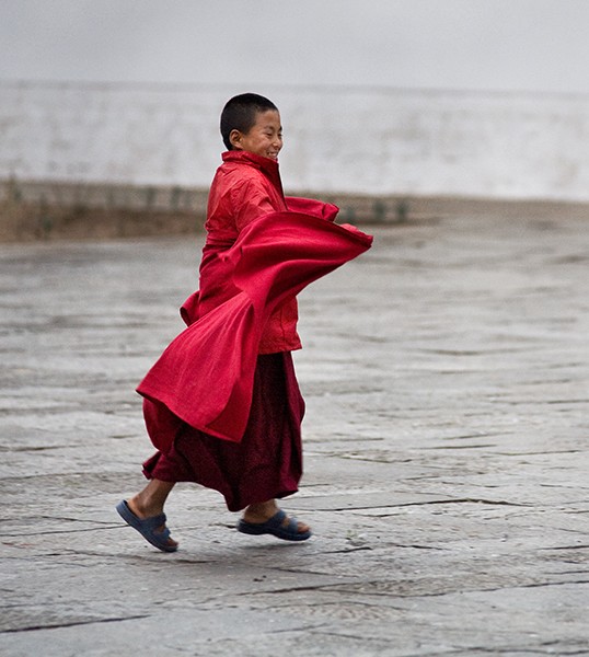 Young Monk Running