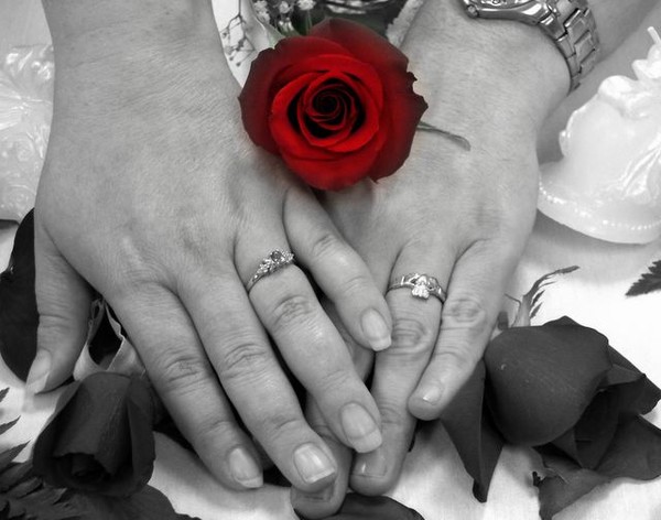 Two hands joined to make one love