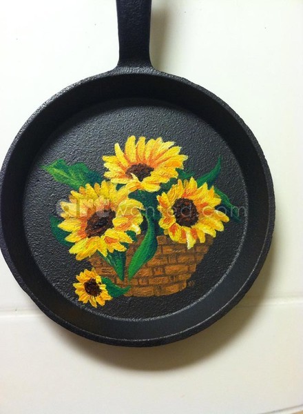 Sunflower in basket on cast iron