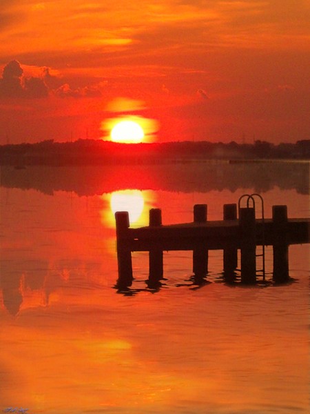 Reflections of a Dock at Sunset