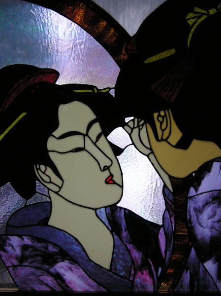 Geisha looking in mirror