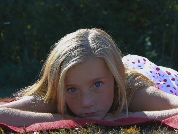 little girl on blanket