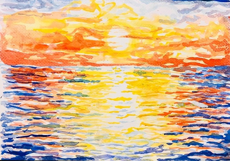 Sky burning at the end of the day like thousands of flames reaching the sea