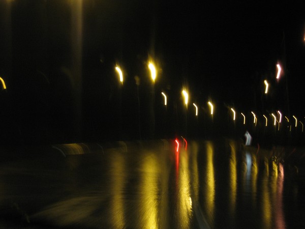 red lights on wet asphalt
