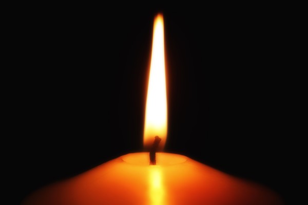By candle light