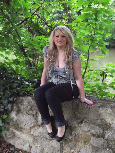 Sitting on the wall by the river
