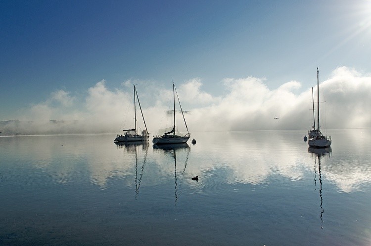 Sailboats-in-the-mist Lake-Maggiore