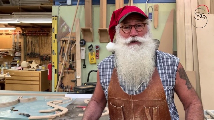 red sled santa in workshop