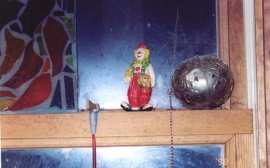 CLOWN IN THE DIRTY WINDOW