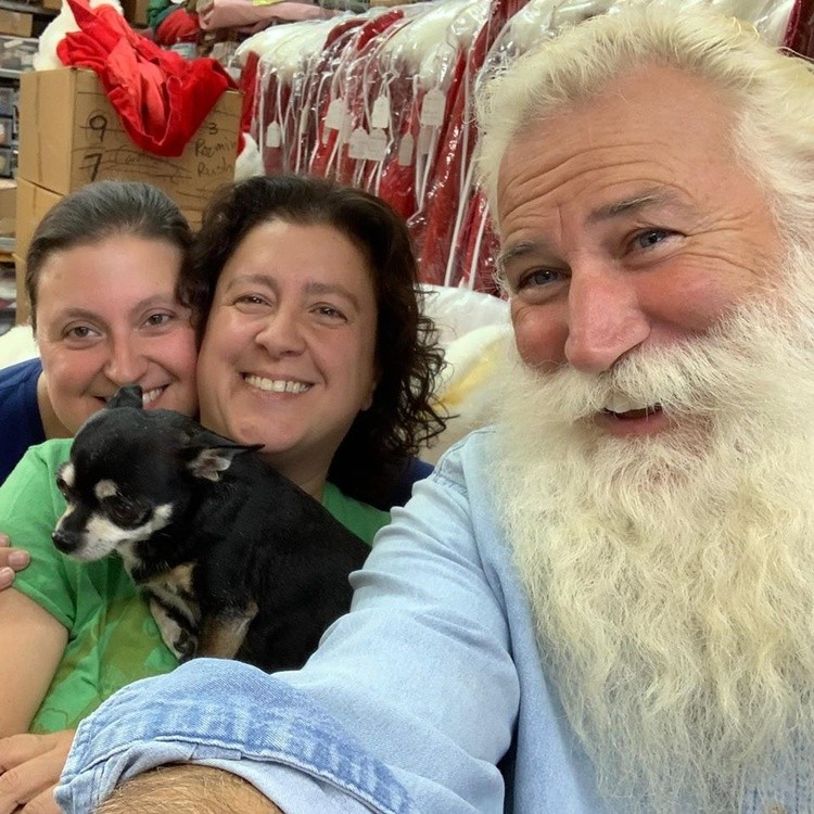 red sled santa with family