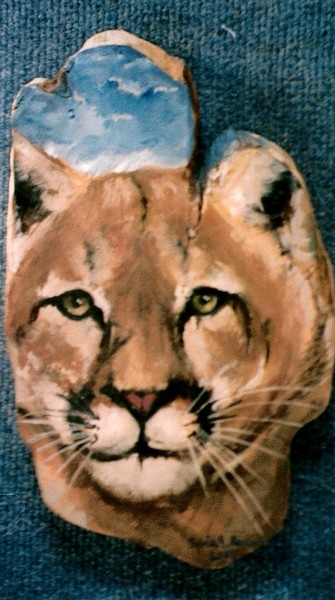 cougar on juniper slab