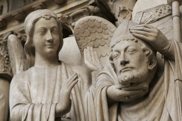 St. Denis holding his head