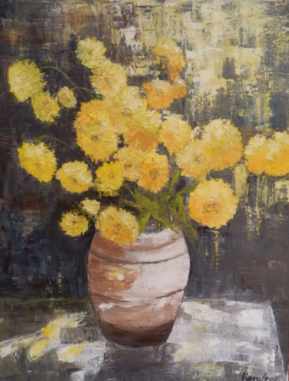 Yellow flowers in terracotta pot