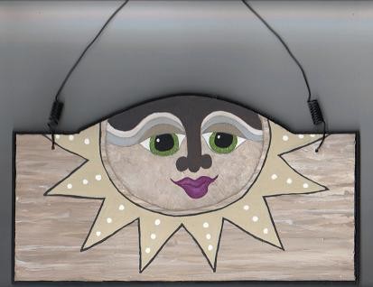 Neutral colored sunface plaque