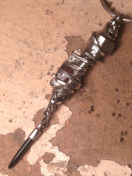Twisted sterling wire pendant w/ uncut garnet