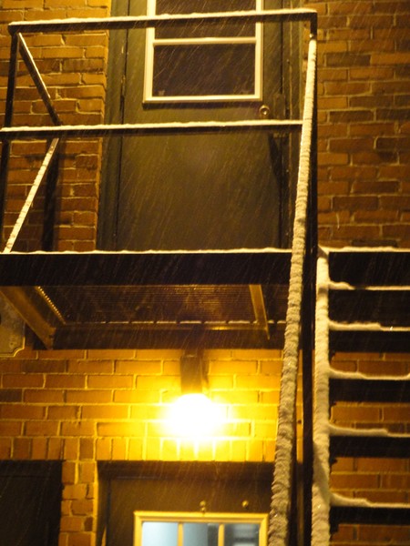 Wet Snow On A Black Metal Balcony