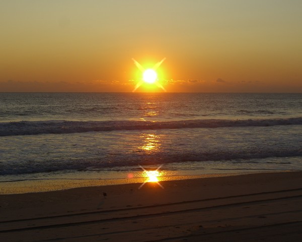 Sunrise at Nags Head N.C. with cross filter.