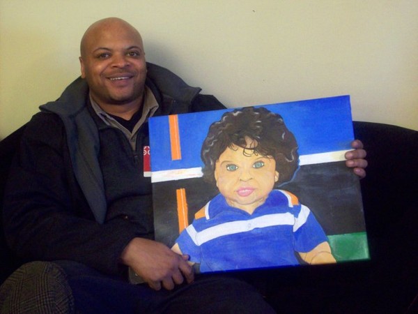 Zair Portrait, James holding his son