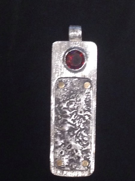 Reticulated sterling silver pendant w/ garnet 