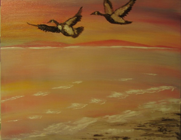 Geese Flying Over Beach