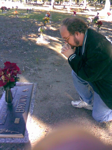 me kneeling at my grandmas grave