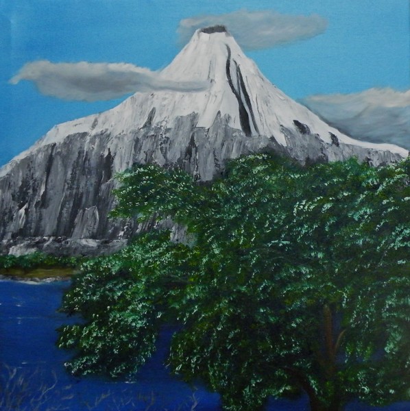 Blooming Tree in Front of a Mountain on a Lake