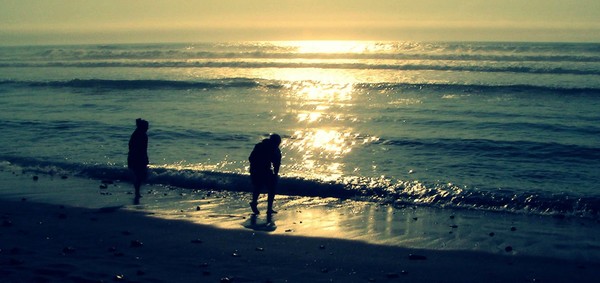 Couple playing by the sea