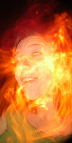 a bright flame on a dark night