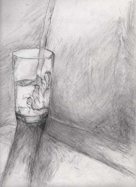 Glass of water being poured