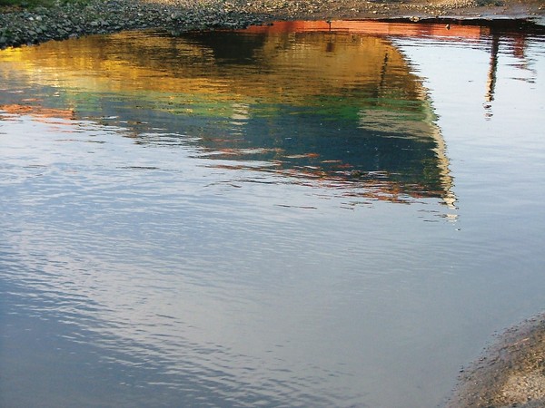 Reflections of a working boat