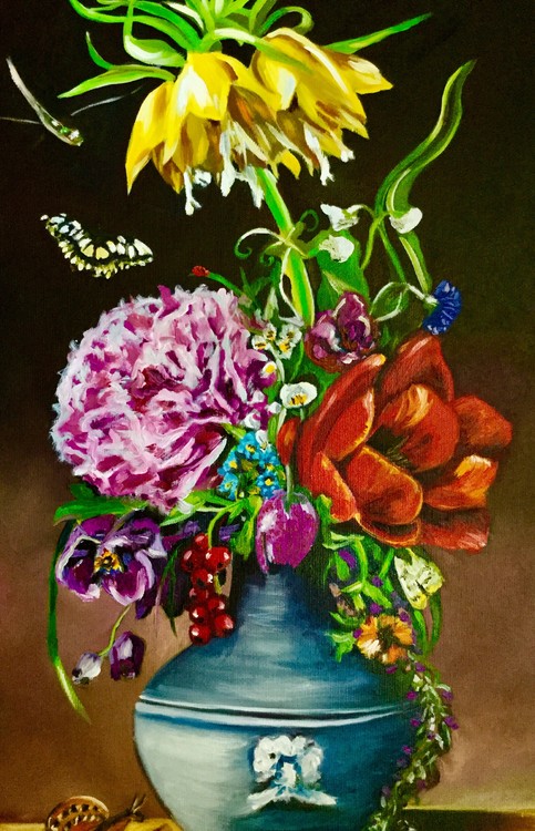 Flowers in a vase with dragonfly.