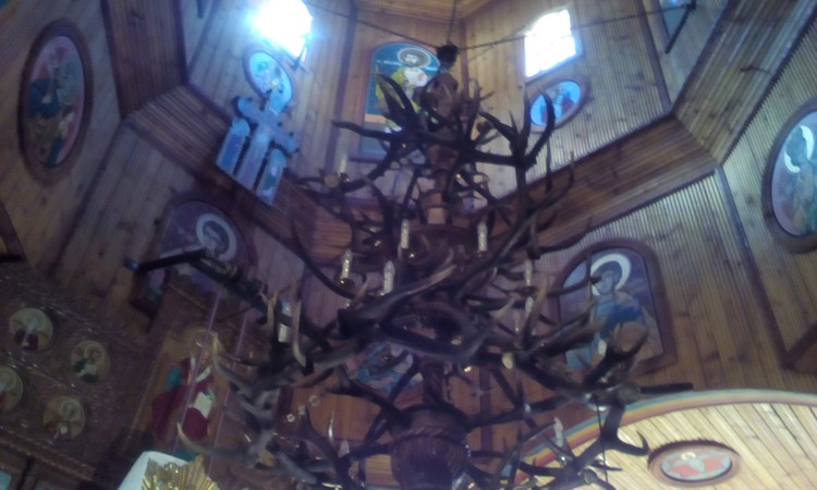 Stag horns candelabrum in mountain village