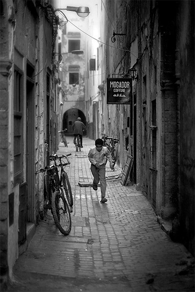 Boy Running In Street