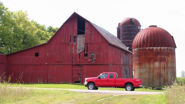 An Old Red Barn and a New Red Truck