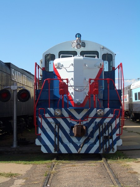 white, red, blue locomotive engine