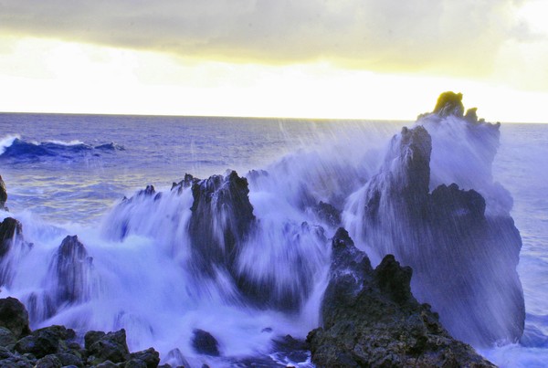 SURF CRASHING ON LAVA