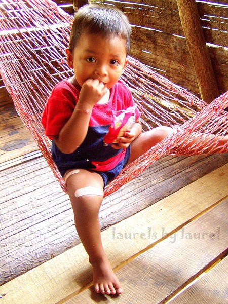Snackin' in the Hammock: A Small Bribri Indian Boy