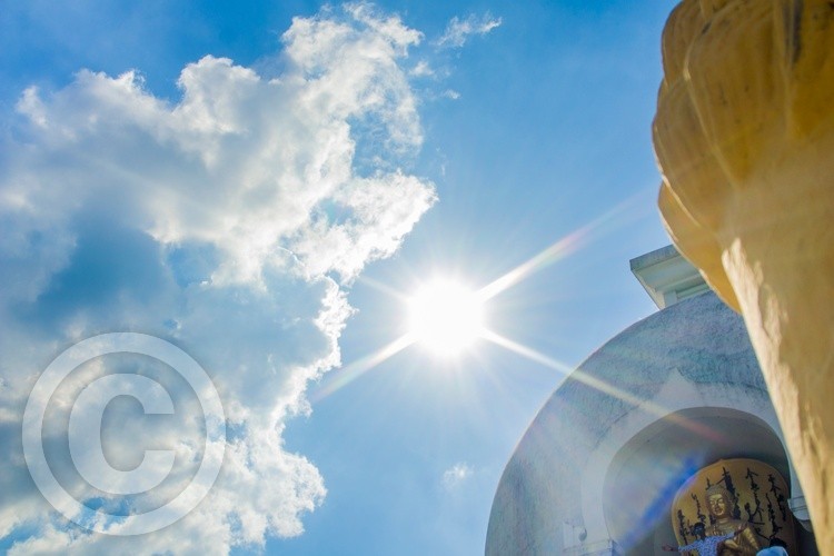 Sunburst over Buddha stupa