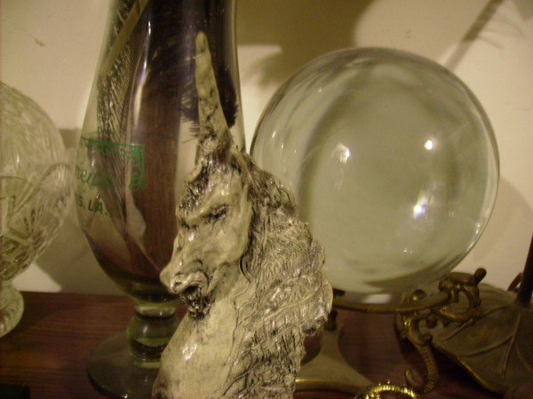 unicorn sculpture and crystal ball