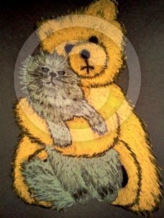 THE CAT AND THE TEDDY BEAR