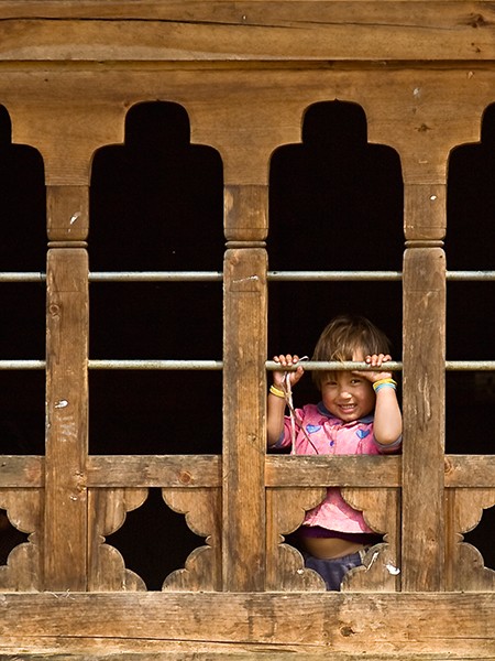 Bhutan, Child in Farm House Window