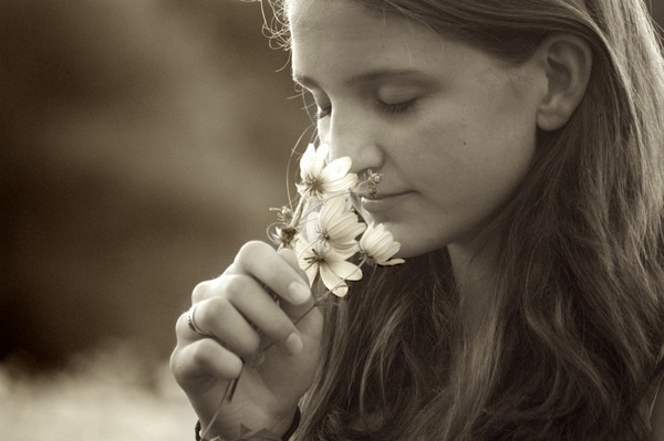 Girl Smelling Flower