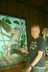 repainting the pub sign