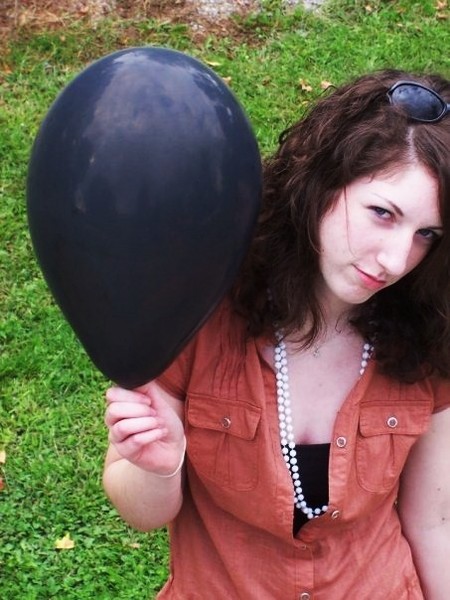 baby's black balloon makes her fly